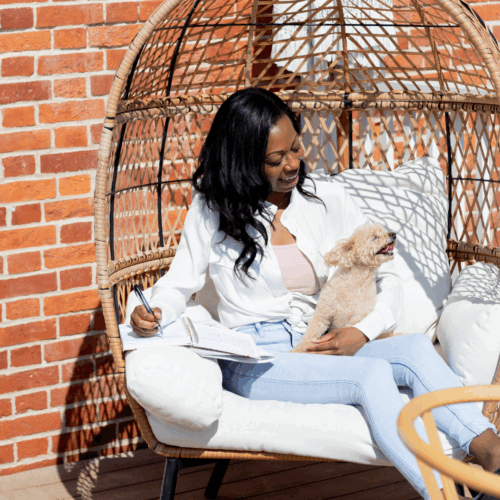 Dog mom relaxing on swing with dog Sugar